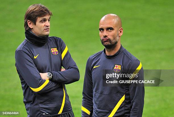 Picture taken on March 27, 2012 shows FC Barcelona's coach Josep Guardiola and deputy coadh Tito Vilanova during a training session on the eve of the...