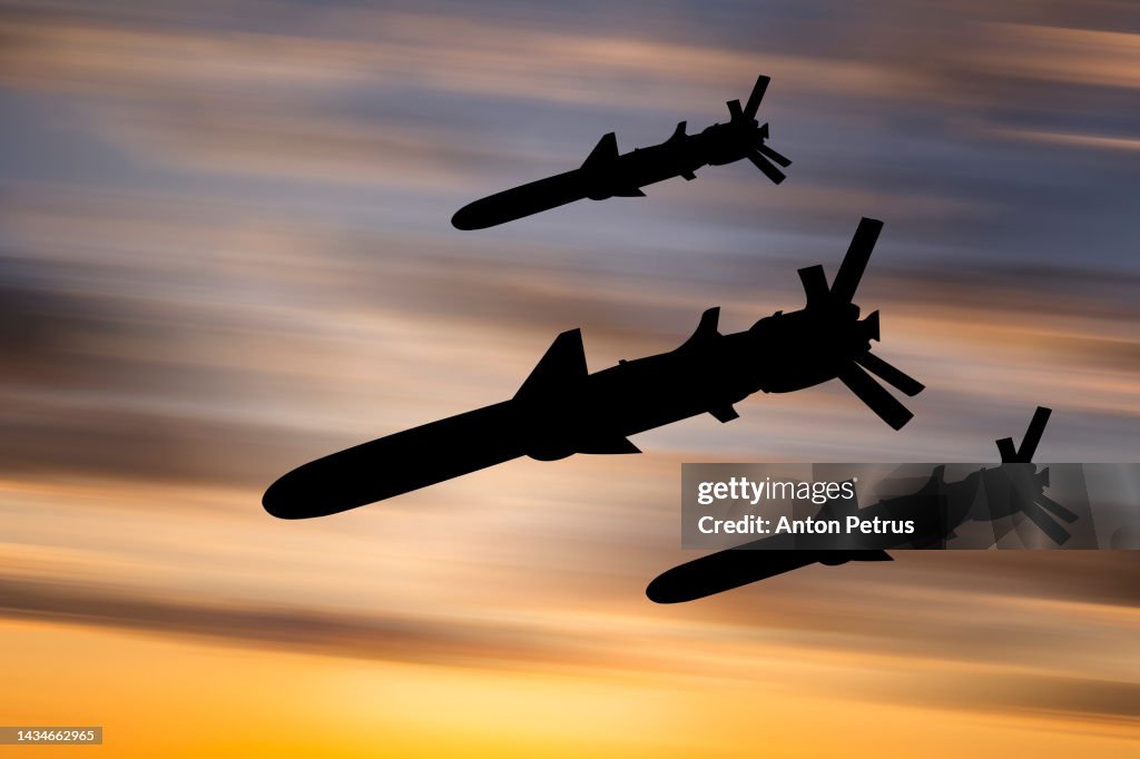 Cruise missiles against the sunset sky