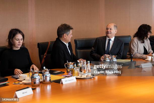 German Chancellor Olaf Scholz talks to Economy and Climate Protection Minister and Vice Chancellor Robert Habeck prior to the weekly government...