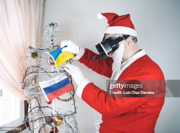 christmas tree in barbed wire with the flag of russia. - escaping jail stock pictures, royalty-free photos & images