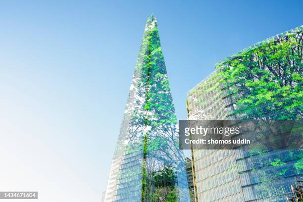 composite of trees and high rise buildings in london - climate finance stock pictures, royalty-free photos & images
