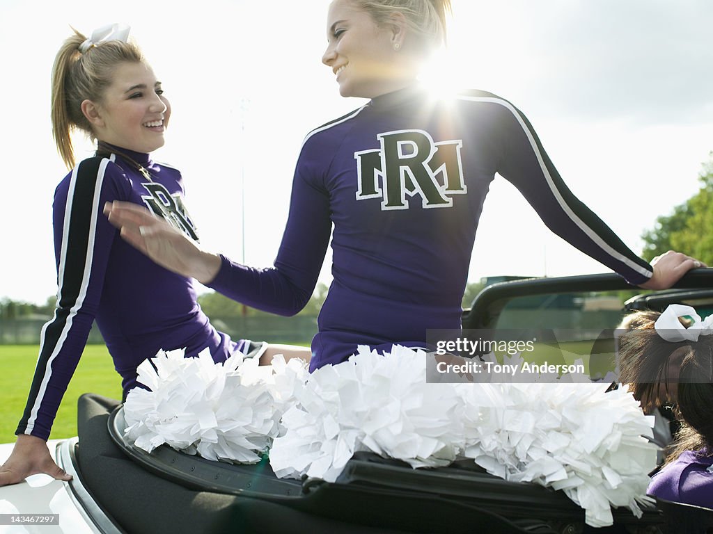 Cheerleaders Riding in Car