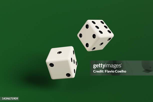 rolling dice - casino table games stockfoto's en -beelden