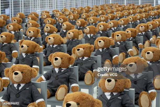 Two hundred teddy bears wearing suits are on display outside a Thom Browne shop on October 19, 2022 in Shanghai, China.