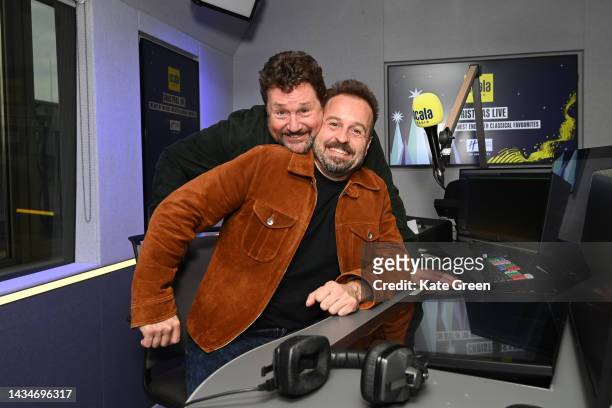 Michael Ball And Alfie Boe pose for a photo during their appearance on Scala radio on October 19, 2022 in London, England.