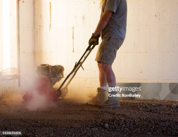 running a plate compactor - work boot stock pictures, royalty-free photos & images