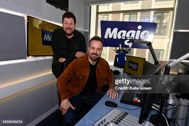 Michael Ball And Alfie Boe pose for a photo during their appearance on Magic radio on October 19, 2022 in London, England.