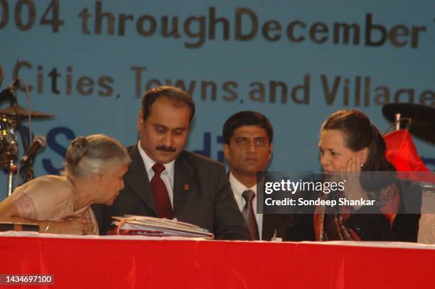 Congress President Sonia Gandhi speaking to Delhi Chief Minister Sheila Dikshit as Health Minister A. Ramdoss looks on during a function to mark the...