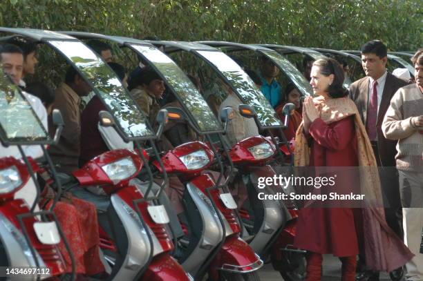 Congress President Sonia Gandhi handing over keys of three wheeler autos to physically impaired persons on the World Disabled Day in New Delhi.