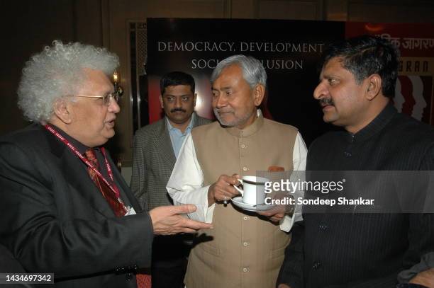 Bihar Chief Minister Nitish Kumar with Lord Meghnad Desai and Bhartiya Janta Party leader Ravi Shankar Prasad at a seminar on Democracy Development...