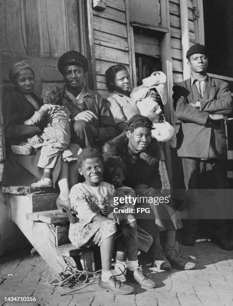 The Houston Fox family sitting on the steps of their home at 219 F Street, Washington, DC, 20th April 1949. The family had been visited by five US...
