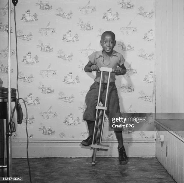 Robert Meyers putting a pogo stick through its paces at 'The Toyery,' the first such establishment in the Harlem neighbourhood of Upper Manhattan,...