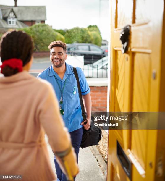 male care nurse visit - visit stock pictures, royalty-free photos & images