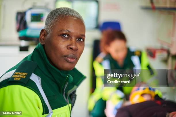 ambulance crew member portrait - ambulance uk stock pictures, royalty-free photos & images