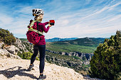 Female cyclist at Belvedere des Glacieres on the Route des Cretes, Verdon Gorge, Provence, France