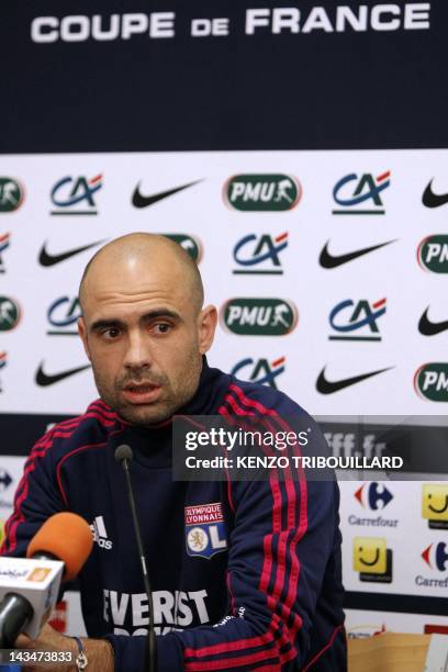 Lyon's Brazilian defender Cris speaks during a press conference on April 27, 2012 at the Stade de France in Saint-Denis, outside Paris, on the eve of...