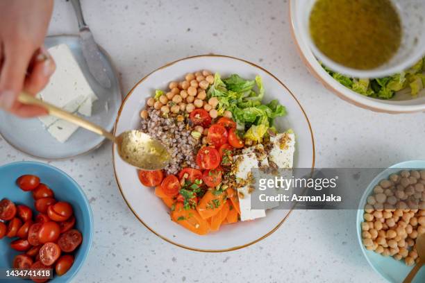 aerial view of the preparation of a colorful healthy salad - chick pea salad stock pictures, royalty-free photos & images
