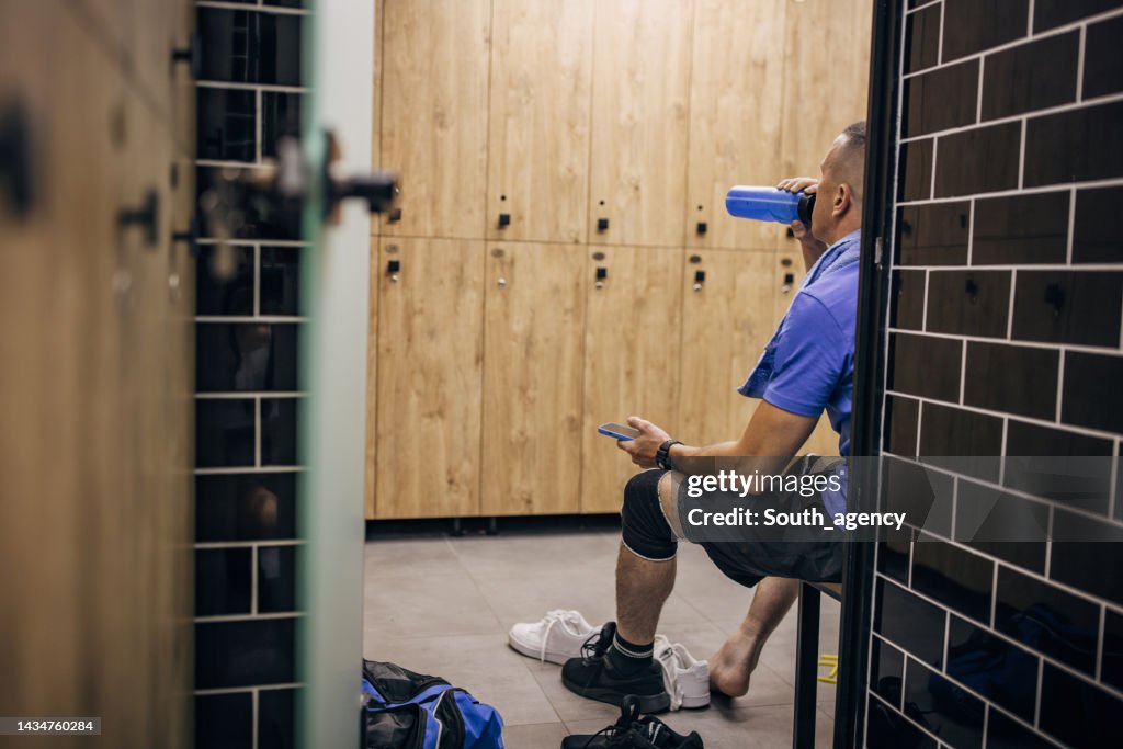 Man in gym locker room