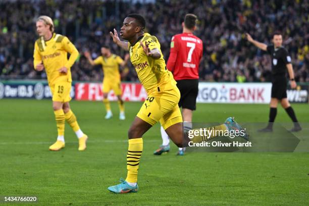 Youssoufa Moukoko of Borussia Dortmund celebrates after an own goal by Bright Arrey-Mbi of Hannover 96 which leads to Borussia Dortmund's first goal...