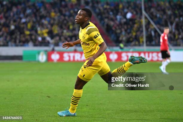 Youssoufa Moukoko of Borussia Dortmund celebrates after an own goal by Bright Arrey-Mbi of Hannover 96 which leads to Borussia Dortmund's first goal...