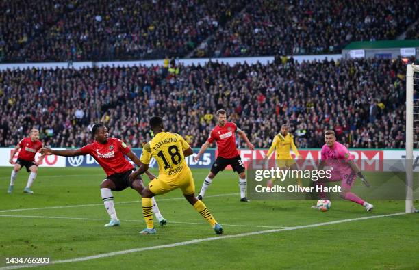 Bright Arrey-Mbi of Hannover 96 scores an own goal which leads to Borussia Dortmund's first goal during the DFB Cup second round match between...