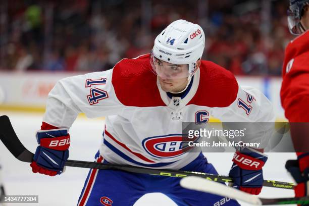 Nick Suzuki of the Montreal Canadiens lines up for a face-off during a game against the Washington Capitals at Capital One Arena on October 15, 2022...