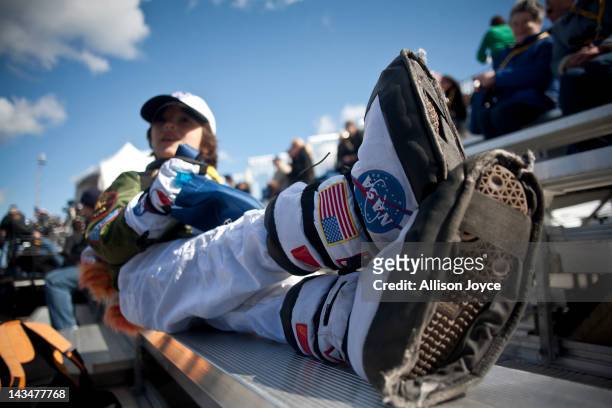 Six-year-old Luca Kasumovich attends a ceremony for the space shuttle Enterprise at John F. Kennedy International Airport April 27, 2012 in the...