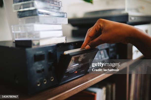 listening to cassette tapes - etereo stock pictures, royalty-free photos & images
