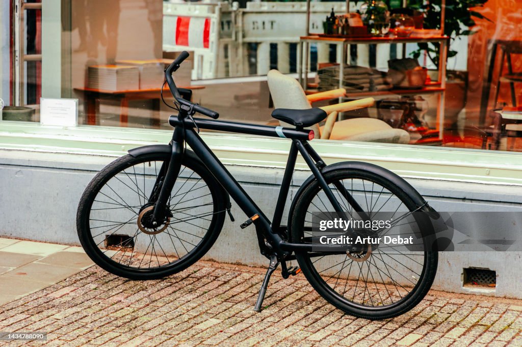 Electric bike with modern design parked in the streets of Amsterdam.