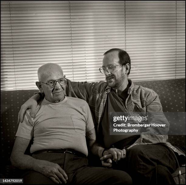 Portrait of Donald Wills and his son, Bailey-Boushay House AIDS inpatient Richard Wills, as they sit together on a couch, Seattle, Washington, 1997....