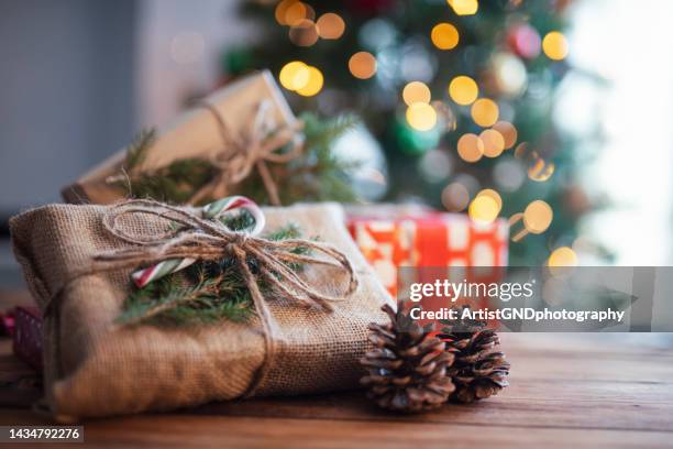 rustic christmas presents. - candy wrapper stock pictures, royalty-free photos & images