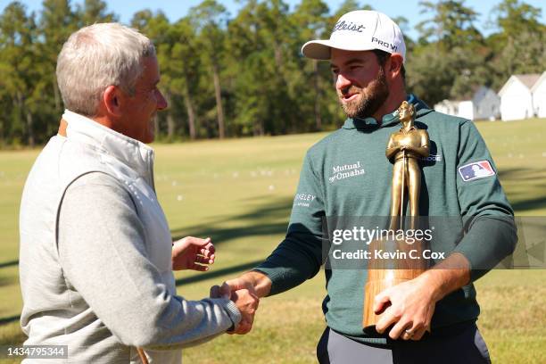 Commissioner Jay Monahan presents the Rookie of the Year Award to Cameron Young of the United States during a pro-am prior to The CJ Cup at Congaree...