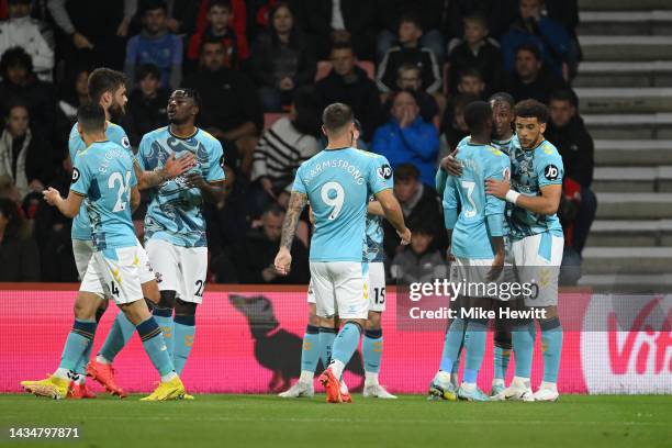 Che Adams of Southampton celebrates scoring their side's first goal with teammates during the Premier League match between AFC Bournemouth and...