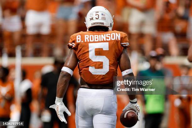 Bijan Robinson of the Texas Longhorns walks to the sideline in the second half against the Iowa State Cyclones at Darrell K Royal-Texas Memorial...