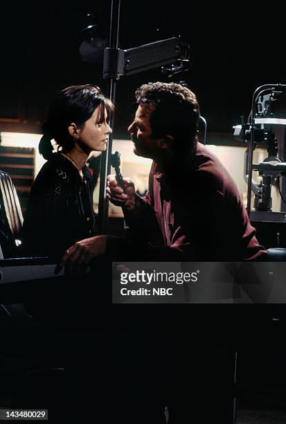 The One Where Ross and Rachel...You Know" Episode 15 -- Pictured: Courteney Cox Arquette as Monica Geller, Tom Selleck as Dr. Richard Burke