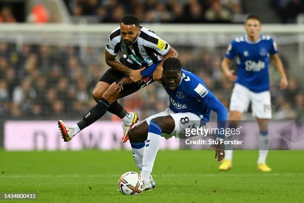 Callum Wilson of Newcastle United is challenged by Amadou Onana of Everton during the Premier League match between Newcastle United and Everton FC at...