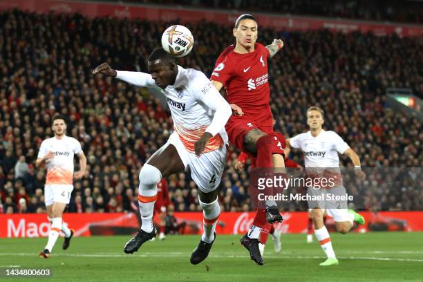 Darwin Nunez of Liverpool jumps for the ball with Kurt Zouma of West Ham United during the Premier League match between Liverpool FC and West Ham...