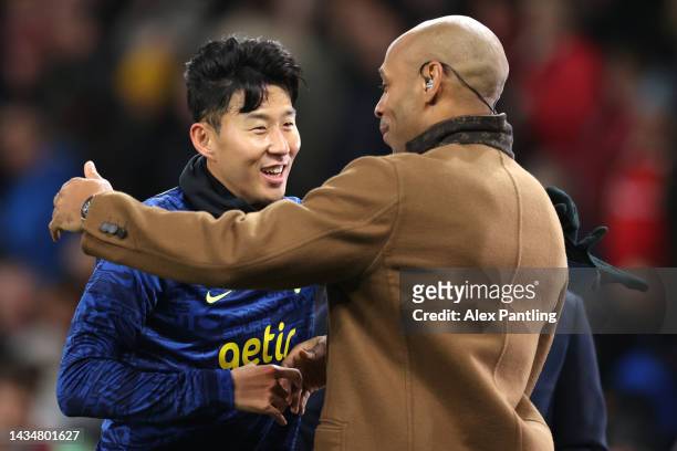 Son Heung-Min of Tottenham Hotspur interacts with Thierry Henry prior to the Premier League match between Manchester United and Tottenham Hotspur at...