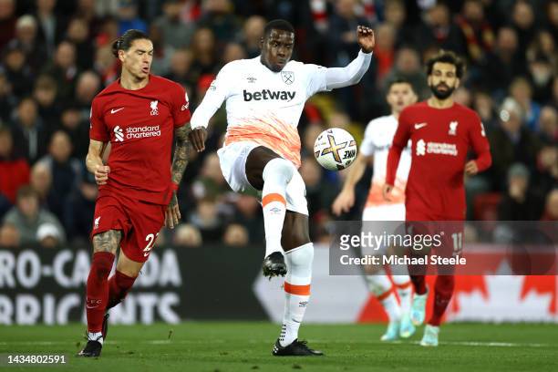 Kurt Zouma of West Ham United battles for possession with Darwin Nunez of Liverpool during the Premier League match between Liverpool FC and West Ham...