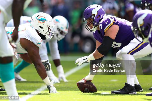 Garrett Bradbury of the Minnesota Vikings lines up against Christian Wilkins of the Miami Dolphins during an NFL football game at Hard Rock Stadium...