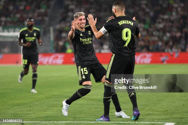 Federico Valverde of Real Madrid celebrates with team mate Karim Benzema after scoring their sides first goal during the LaLiga Santander match...