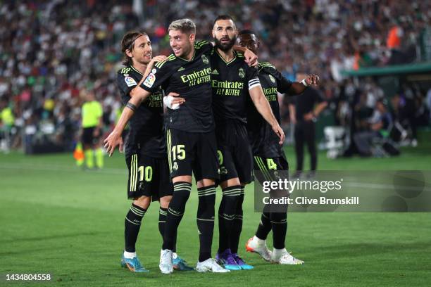 Federico Valverde of Real Madrid celebrates with team mates Luka Modric, Karim Benzema and David Alaba after scoring their sides first goal during...