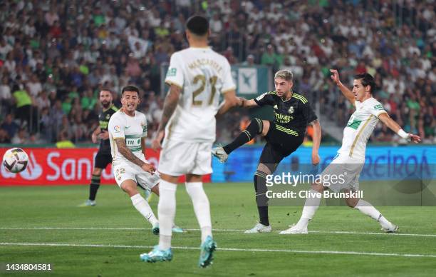 Federico Valverde of Real Madrid scores their sides first goal during the LaLiga Santander match between Elche CF and Real Madrid CF at Estadio...