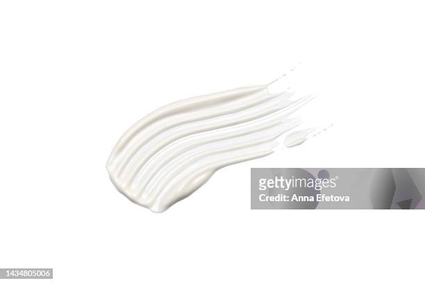 textured cosmetic smear of white cream isolated on white background.  also it can be hyaluronic acid, polyglutamic acid or serum with peptides, ceramides, retinol molecules, aha acid. concept of health and wellbeing. flat lay style with copy space - jojoba oil stock pictures, royalty-free photos & images
