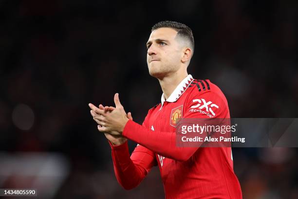 Diogo Dalot of Manchester United applauds fans during the Premier League match between Manchester United and Tottenham Hotspur at Old Trafford on...