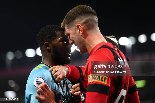 Ainsley Maitland-Niles of Southampton confronts Chris Mepham of AFC Bournemouth during the Premier League match between AFC Bournemouth and...