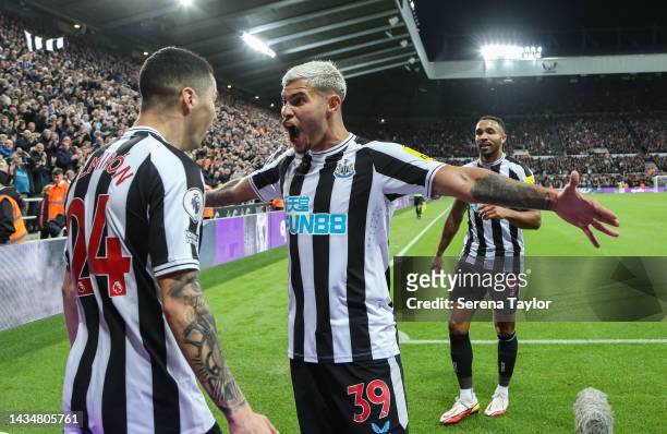 Miguel Almirón of Newcastle United FC and Bruno Guimaraes of Newcastle United celebrate Miguels opening goal during the Premier League match between...
