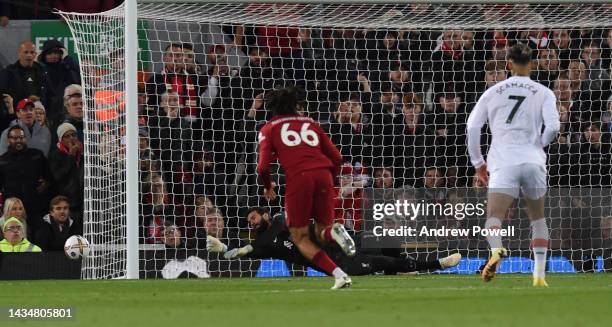 Alisson Becker of Liverpool saves Penalty during the Premier League match between Liverpool FC and West Ham United at Anfield on October 19, 2022 in...