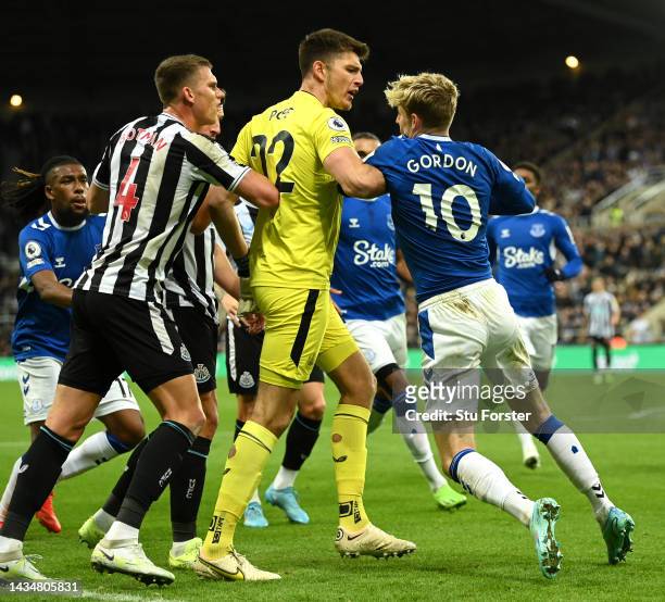 Nick Pope of Newcastle United steps in as tempers flare between the Newcastle United defence and Anthony Gordon of Everton during the Premier League...