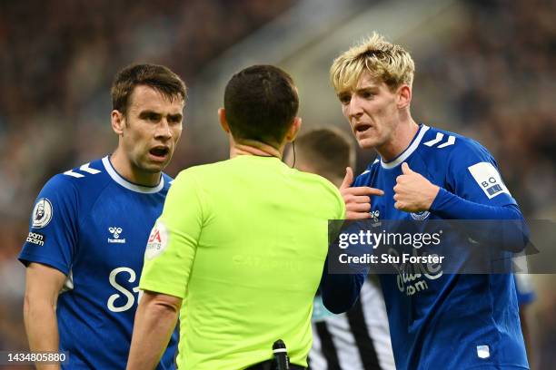 Referee Tony Harrington is confronted by Anthony Gordon of Everton after awarding them a yellow card during the Premier League match between...